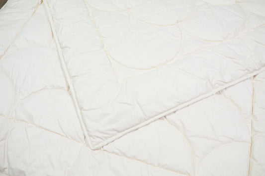 Steppbett aus 100% kbA Baumwolle – Bezug und Füllung in Bio-Qualität | KLEINER Naturbettwaren
